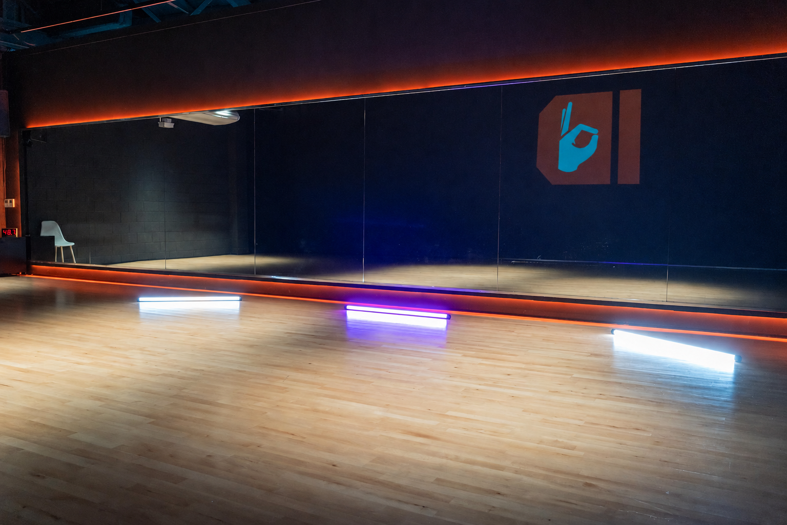 Coloured tube lights beside studio mirrors